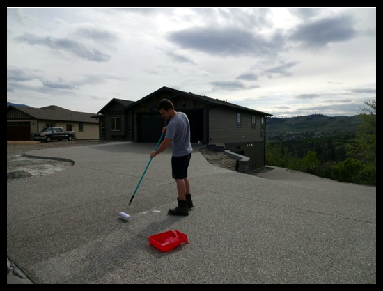 Building a Home in Coldstream, Eighth Month, my son helped with sealing the driveway.